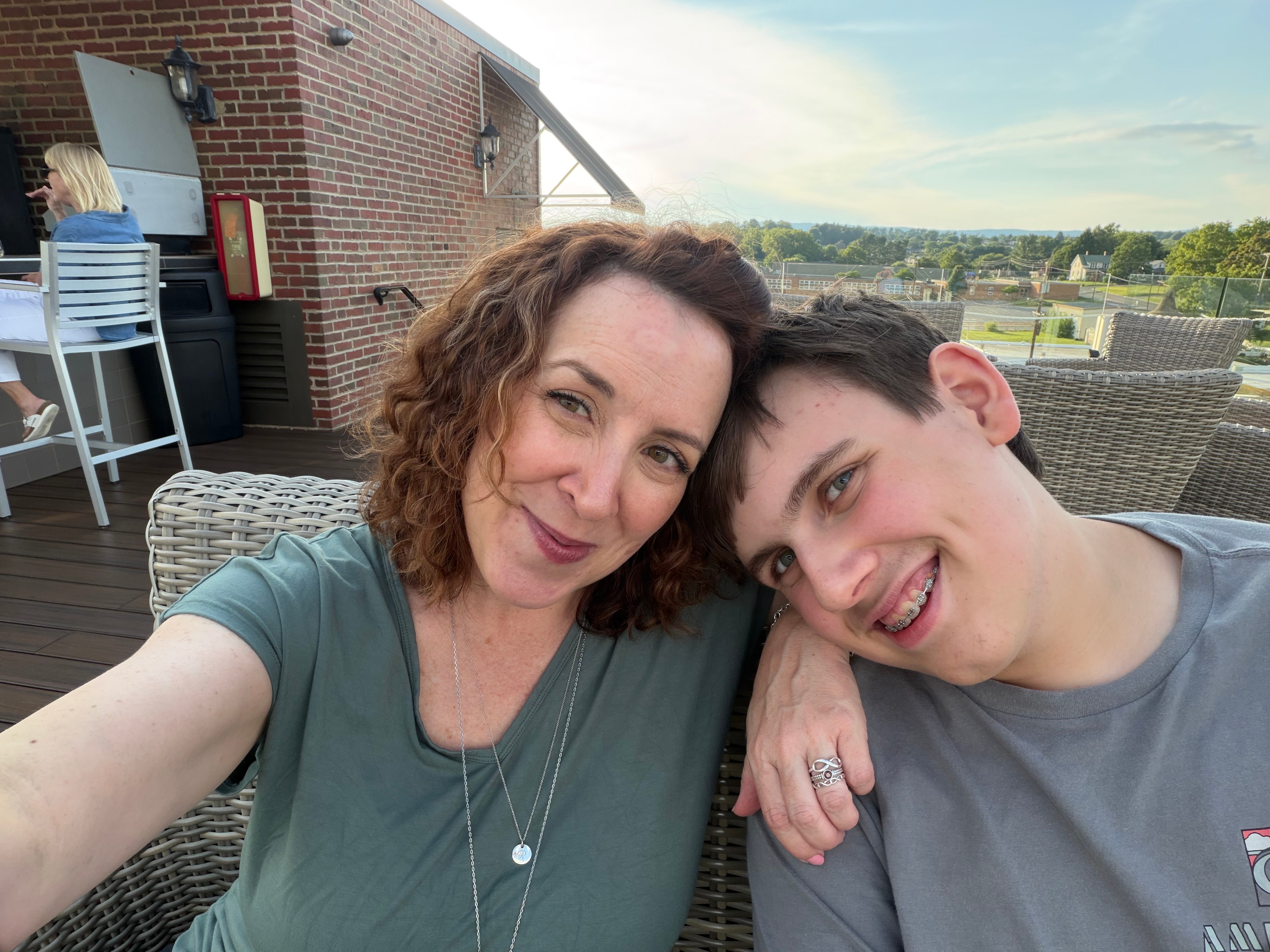 mother and son on rooftop restaurant