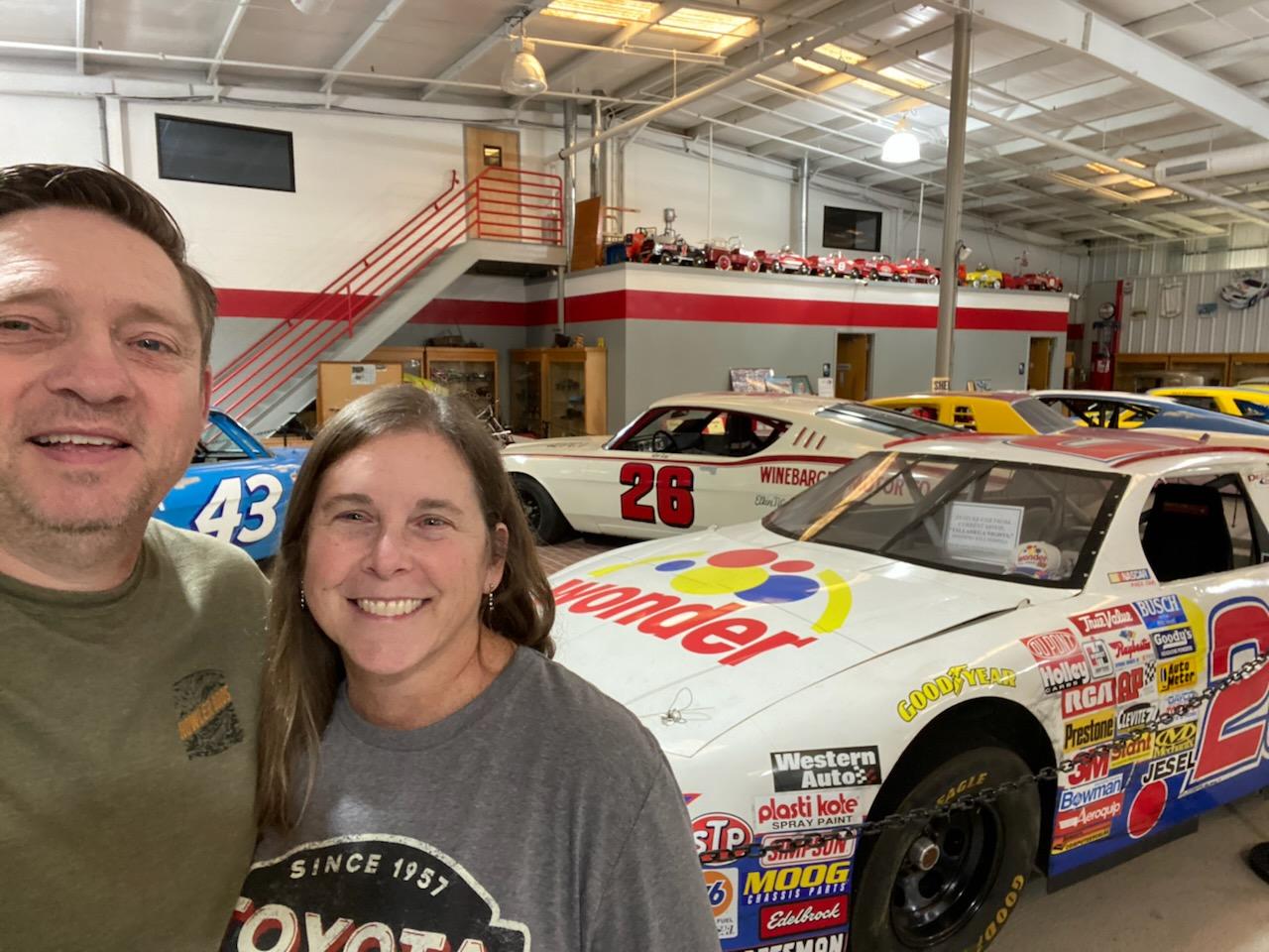 husband and wife with racecar