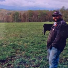 cattle farmer in field